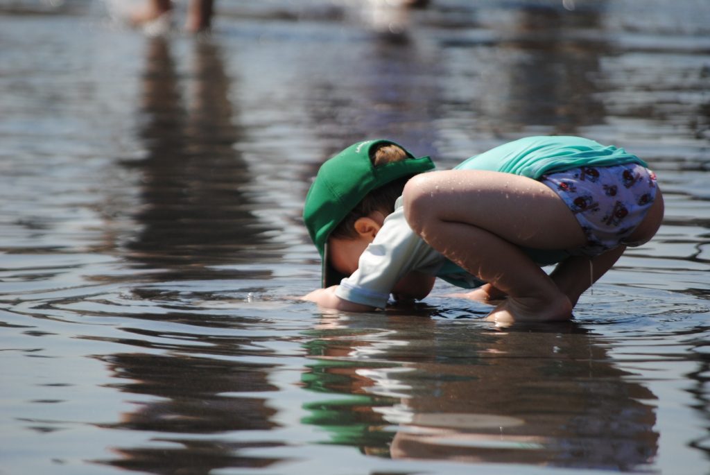 child playing in water